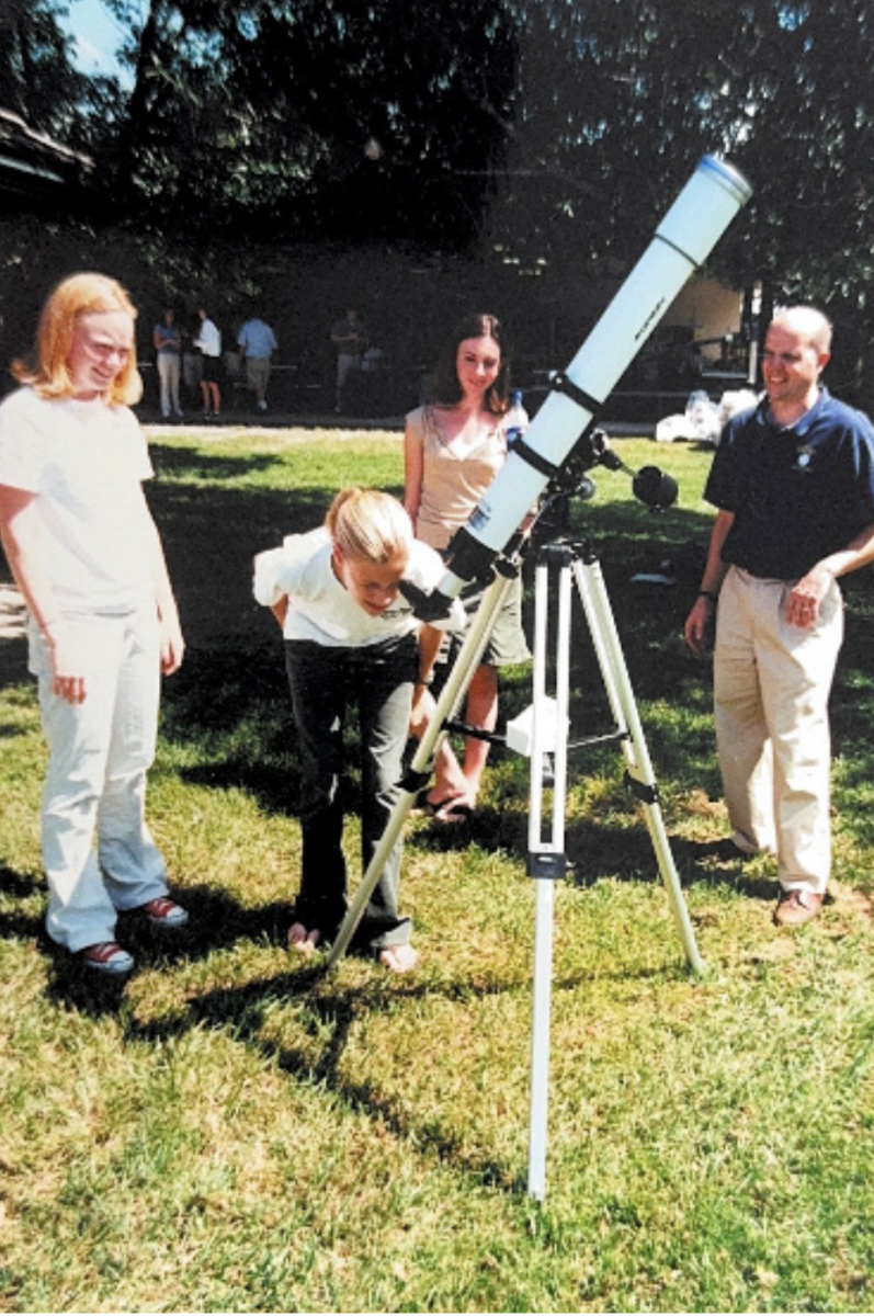 Boerth, adviser of the astronomy club from 2002 to 2012, uses a telescope with a solar filter to observe sun spots.
Photo by Robbie Boerth, used with permission.